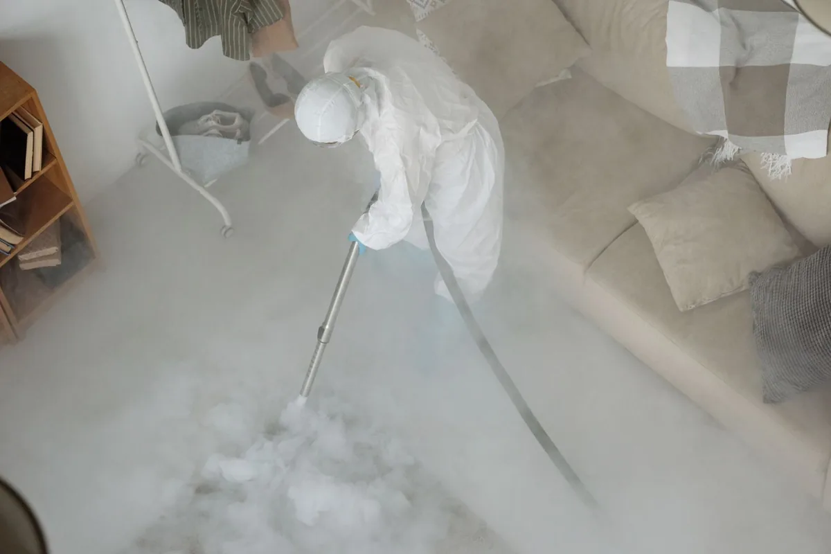 Biohazard cleanup technician in protective equipment, Downtown, Detroit, MI
